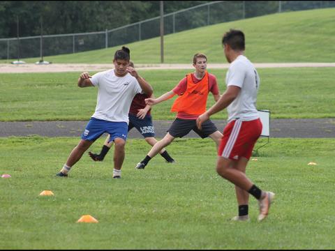 Press photo/Will Woolever - FHS soccer players (from left) Pablo Montelongo, Luke VanHook and Bryan Rodriguez take part in a preseason conditioning drill. The team has been holding unofficial workouts since June.