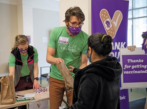 Press photo/submitted - Lane Perry, director of WCU’s Center for Community Engagement and Service Learning, and Cortnee Lingerfelt, director of the WCU Vaccine Clinic partnered with Vecinos to vaccinate 100 farmers in WNC against Covid-19. 