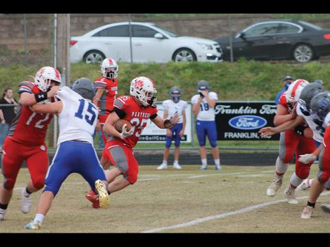 Press Photo/Will Woolever - Senior fullback/outside linebacker Evan Klatt carries against Smoky Mountain in the final game of his Panthers career April 9. Klatt went out with a bang, recording 183 yards and 4 touchdowns on 27 carries.
