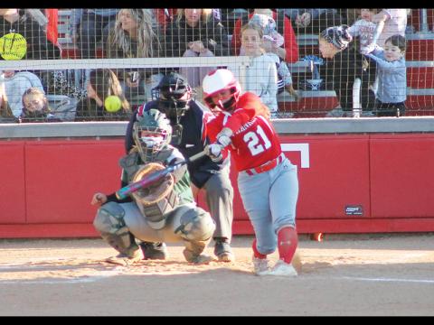 Senior second baseman Nevaeh Tran belts a home run against East Henderson April 22. Tran hit two two-run homers in the game.