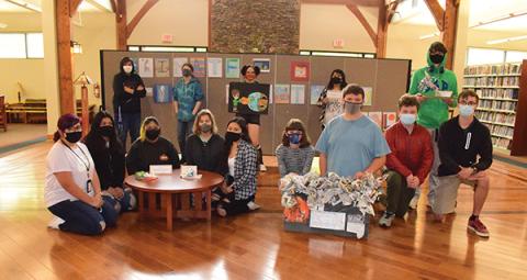 Press photo/Linda Mathias Ninth grade students in the Earth Environmental Science class at Macon Early College used art to demonstrate ideas about climate change and solutions. Their art is on display at the Macon County Public Library through June.