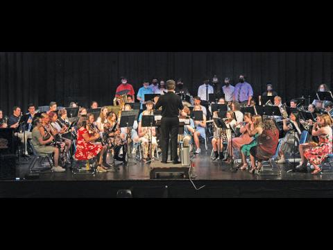 Press photo/Jake Browning - The Franklin High School symphonic band, led here by student director Zack Brown of Western Carolina University, performed its first concert in 16 months on Monday night..