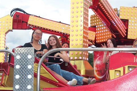 Press photos/Jake Browning - Mya Crisp and Lexi Hoyt take a whirl at the Shriners Carnival, which continues through June 12.