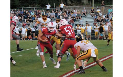 Press Photo/Will Woolever - Senior running back/safety Kellen Stiles meets a Murphy linebacker in the hole in Franklin’s 35-15 win at the Panther Pit Aug. 20.