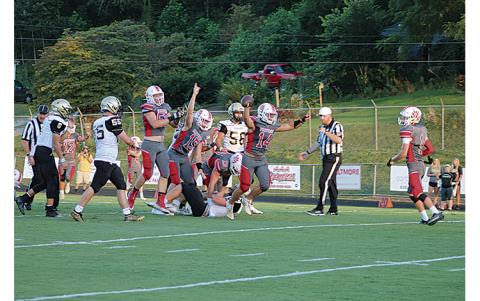 Press Photo/Will Woolever - Junior linebacker/fullback Brayden Watts (#14) celebrates after recovering a first-quarter Hayesville fumble Aug. 27.