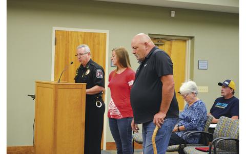 Press photo/Mia Overton Franklin Police Chief Bill Harrell presented Brandy Burns and James Hampton with certificates of valor at the Town Council meeting on Aug. 2. Harrell thanked Hampton and Burns for their “courageous assistance” when they came to his aid during an incident on June 11 at Macon Plaza. The suspect lunged at Harrell knocking him off balance and tried to drive away in the police chief’s car. Hampton and Burns helped Harrell subdue the suspect until other officers arrived on the scene. “Thei