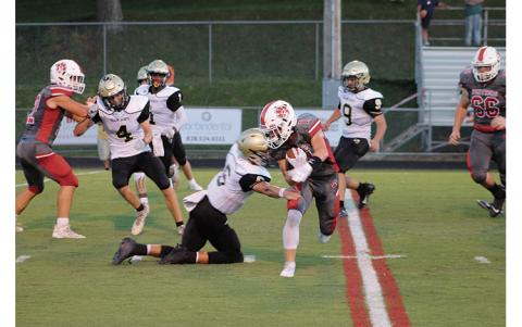 Press Photo/Will Woolever - Senior wide receiver/defensive back Grant Adams attempts to shed a tackle against Hayesville Aug. 27. Adams was named this week’s Wayah Insurance Player of the Game after catching the game-winning interception against Swain. 