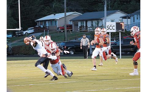 Press Photo/Will Woolever - Junior Davis Anders lays a hit on a Tuscola ballcarrier as teammates (from left) Keagan Pollock, Ty Handley and Brayden Watts look on.