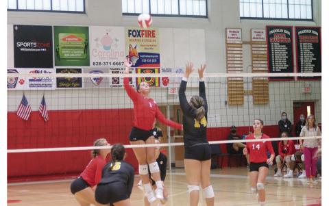 Press Photo/Will Woolever Sophomore middle hitter Avery Moffitt attempts a kill in Franklin’s 3-0 victory over Tuscola Sept. 1