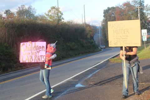 People protesting the use of face masks in schools prior to the Oct. 25 School Board meeting. The school board voted Monday night to make masks optional due to the decline in active cases in the schools and the community.