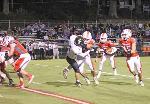 Press Photo/Will Woolever - Tailbacks Brayden Watts (#14) and Ty Handley (#15) throw a block for quarterback Chris McGuire against Tuscola Sept. 24. Handley gained 75 all-purpose yards and a rushing touchdown versus Pisgah.