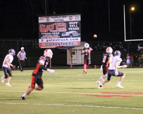 Press Photo/Will Woolever - Senior quarterback Chris McGuire attempts a pass for senior receiver Keagan Pollock against Smoky Mountain Oct. 15. Senior Grant Adams (right) occupies a Mustang defender away from the throw.