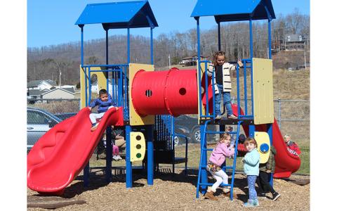 Press photo/Jake Browning Macon County Schools is currently accepting applications for the Pre-K program for the 2022-2023 school year. The Board of Commissioners and Macon County Schools are exploring ways to expand the program so more children can attend. Pictured are Pre-K students at South Macon Elementary School enjoying a sunny winter day on the playground for Pre-K students. 