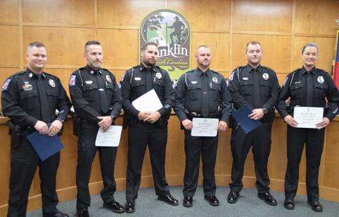 Press photo/Mia Overton - Police Chief Bill Harrell announced several promotions within the department during Monday night’s Town Council meeting. Pictured (from left) First Sgt. Randy Dula, Street Poisons Enforcement Eradication Directive; Capt. Matt Pellicer, Criminal Investigations Division and Support Services; First Sgt./Detective Justin Norman, investigations; Patrol Sgt. Justin Riles; Patrol Sgt. Matthew Bingham; Master Officer III Kelly Jo Fosler.