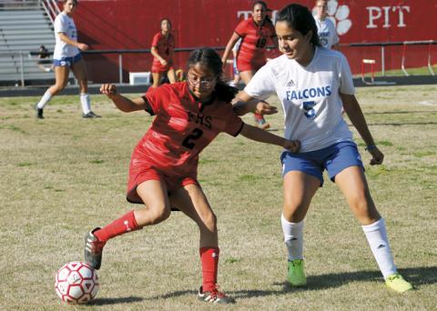 Press photo/Will Woolever - Sophomore defender Briseida Tlahuice tries to shake a West defender at the Panther Pit April 4. 