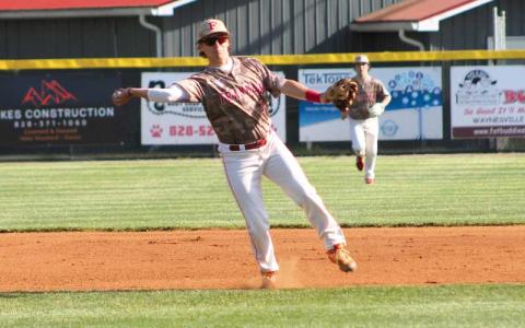 Press photo/Will Woolever - Junior shortstop Ian Knepp throws to first versus A.C. Reynolds April 19 at McConnell Field. 