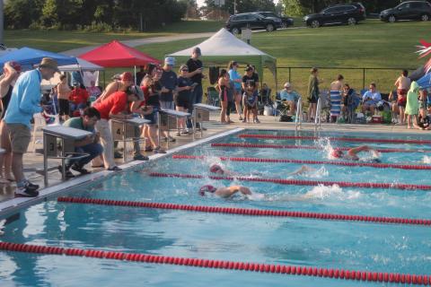 Press photo/Will Woolever - Franklin Amateur Swim Team timers watch a photo finish between Kenna Keyworth (foreground) and Breanna Pendergrass in the girls 13-14 50-yard freestyle. The team kicked off their summer season versus the Jackson County Swim Team at the Macon County Rec Park June 8. 