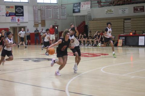 Freshman Will Rauers drives to the basket in a scrimmage vs. Cherokee June 5 on Tom Raby Court (Press photo/Will Woolever).