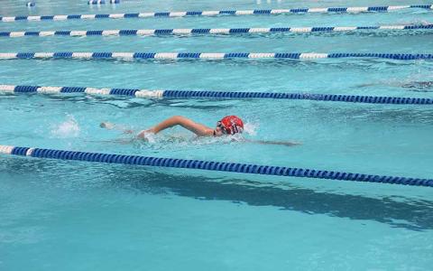 Wylie Dilbeck competes in the boys 11-12 100-yard freestyle at the Mountain Swim League All-Star Meet in Sylva July 22. 