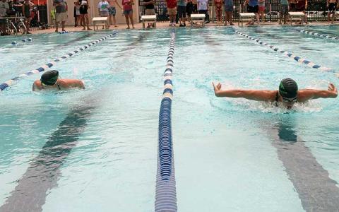 Press photo/Will Woolever - Franklin Amateur Swim Team standouts Zoi Walker (left) and Claire Ballard compete in the girls 15-18 100-yard butterfly at the Mountain Swim League All-Star meet July 22. 