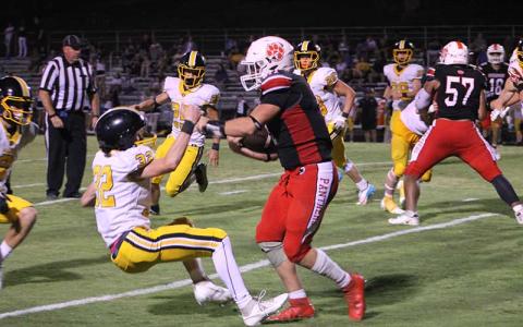 Press photo/Will Woolever - Junior Braydon Hervey bulldozes a Murphy defender at the Panther Pit Aug. 18. 