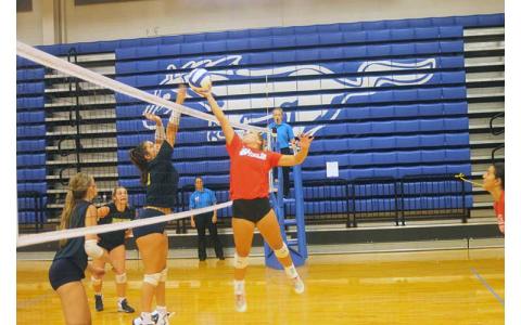 Press photo/Will Woolever - Senior setter/defensive specialist McCall Sanders pushes a ball over the net in a preseason scrimmage with T.C. Roberson at Smoky Mountain July 27. 