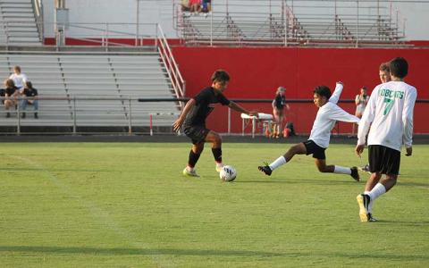 Press photo/Will Woolever - Senior Ulises Padron-Perez (left) puts a BREC defender on skates Aug. 21. 