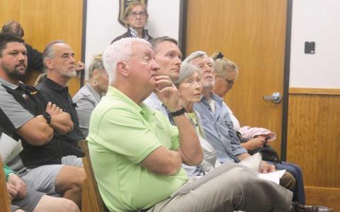 Press photo/Thomas Sherrill - Board of Education Chair Jim Breedlove and Superintendent Josh Lynch listen to discussion about the new Franklin High School at the Sept. 12 Macon County Board of Commissioners meeting.