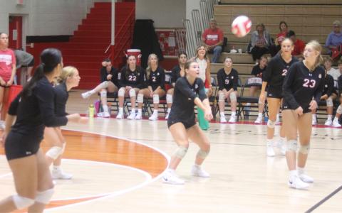 Press photo/Will Woolever Junior outside/opposite hitter Cali Queen sets a ball versus Tuscola Aug. 29 on Tom Raby Court. 