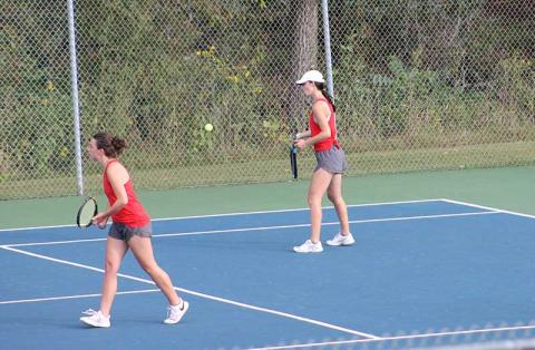 Press photo/Will Woolever - Junior Maci Stork (right) forehands a ball in a doubles match with Logan Guynn versus Pisgah Sept. 25. 