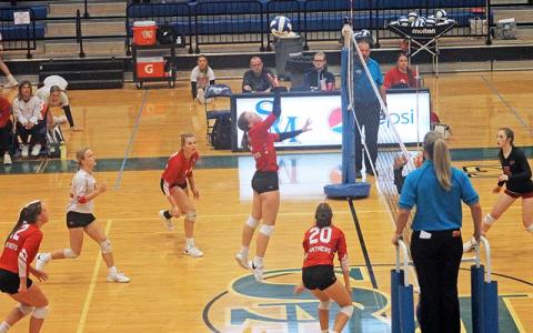Press photo/Will Woolever - Freshman Danni Ledford lifts a ball over the net in the Mountain Seven Conference JV Final versus Pisgah Oct. 18. 
