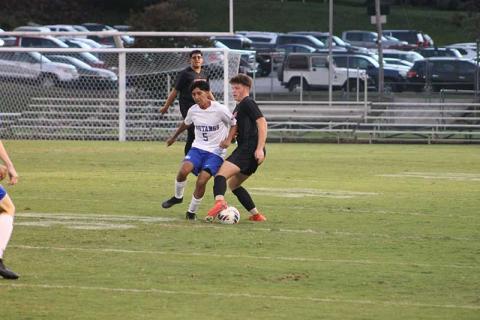 Senior left back Jaydon Pevia fights for possession against Smoky Mountain Sept. 25 at the Panther Pit. (Press photo/Will Woolever)