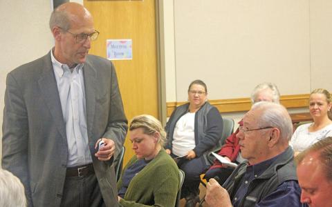 Press photo/Thomas Sherrill Franklin Mayor Jack Horton, seated right, speaks to Ronald Winters of Gibbins Advisors during a Nov. 1 community meeting.