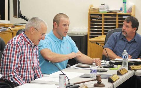 Press photo/Thomas Sherrill - Chair Paul Higdon and Commissioners Josh Young and John Shearl at the Nov. 14 board meeting.