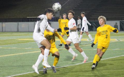 Press photo/Will Woolever Senior Ulises Padron-Perez heads the ball in Franklin’s second-round playoff match at A.C. Reynolds Nov. 2. 