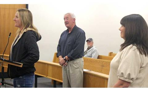 Press photo/Thomas Sherrill - School board members Diedre Breeden, Chair Jim Breedlove and Hilary Wilkes spoke at the Dec. 12 Macon County Commissioners meeting. 