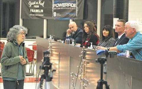 Press photo/Thomas Sherrill - Olga Pader speaks during public comment to the Macon County School Board during its Monday, Dec. 11, meeting.