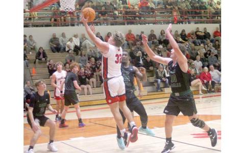 Press photo/Will Woolever - Junior center Braydon Hervey attempts a layup versus East Henderson Dec. 15. 
