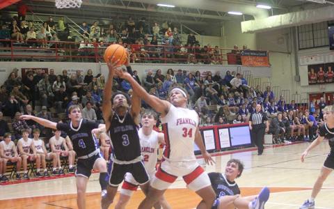 Press photo/Will Woolever - Senior Jacob Gibson battles for possession versus Smoky Mountain Jan. 12. 