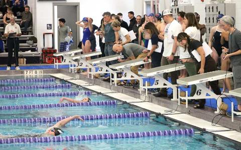 Press file photo - Freshman Eleanor Kessler finishes the 100-yard backstroke at T.C. Roberson Jan. 13. 