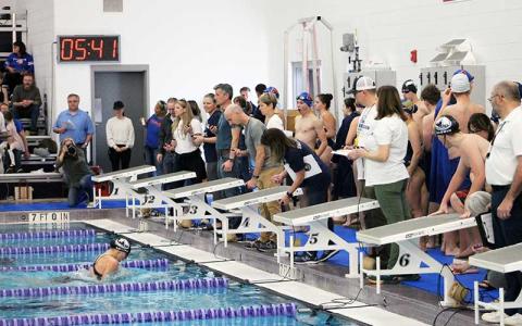 Press photo/Will Woolever - Senior Claire Ballard nears the end of her record-breaking 100-yard breaststroke at T.C. Roberson Jan. 13. 