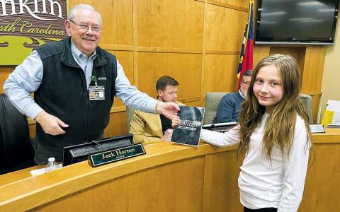 Press photo/Mia Overton - Gracie Parker presents Mayor Jack Horton a copy of the book “Shattered: Stories of Lives Broken by Substance Abuse and How We Put the Pieces Back Together.” Parker’s story is included in the book. Parker spoke at the Feb. 5 Town Council meeting and requested a street closure for her second annual youth mental health rally. The event will be held on Sunday, April 28.