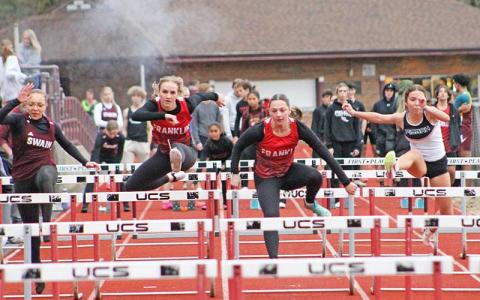 Press file photo - Senior Talley Kinsland (left) and junior Addison Coker compete in the 55-meter hurdles at Swain Jan. 24.