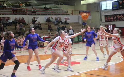 Press photo/Will Woolever - Sophomore center Meliah Mason (left) and freshman guard Rylee Green fight for a loose ball versus West Henderson Feb. 15. 