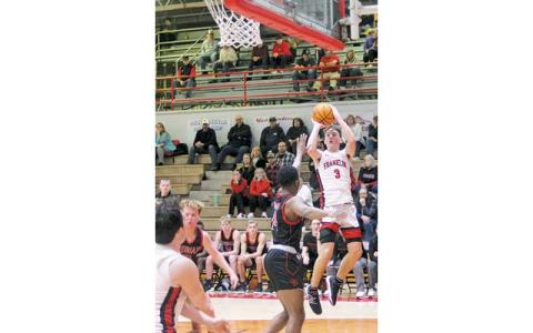 Press file photo - Junior guard Max McClure attempts a short jump shot versus Pisgah Feb. 19.