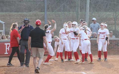 Press photo/Will Woolever - Sophomore Kendall Rumans (center) crosses home plate after one of her two home runs versus Tuscola March 14.  