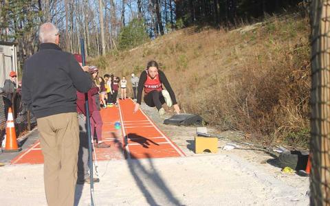 Press photo/Will Woolever - Junior Addison Coker competes in the long jump at Swain Nov. 29, 2023.  