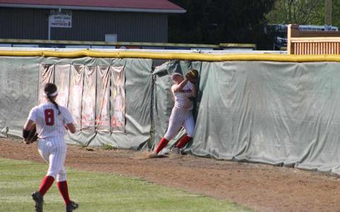 Press photo/Will Woolever - Senior Jozy Dehart catches a hard-hit line drive while crashing into the outfield wall versus North Henderson April 24.