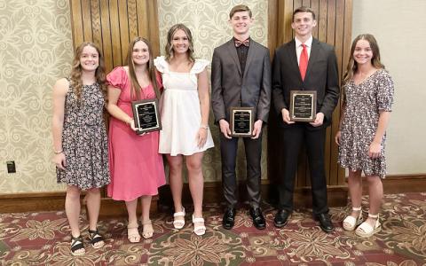 Photo submitted. (From left) Lydia Holland, track and field standout Claire Hovis, Moffitt, Cochran, track and field standout Braxton Deal, Laura Holland are pictured at the WNC Sports Awards Banquet in Asheville May 19. 