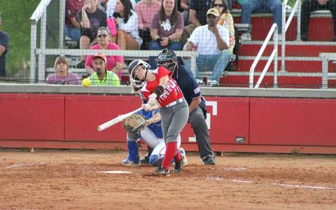 Press photo/Will Woolever - Freshman Anna Stiles makes contact with a pitch versus West Henderson April 30.  